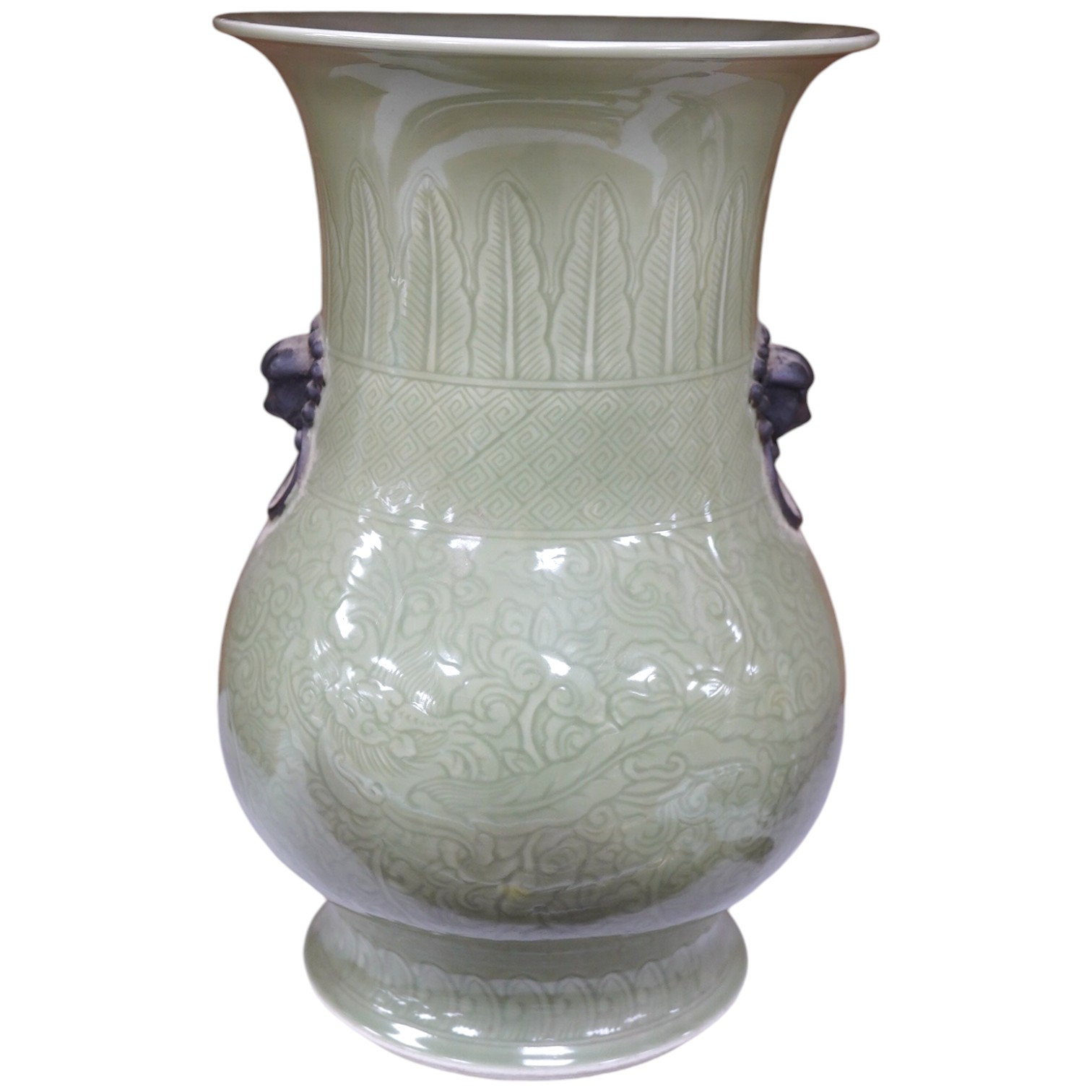 A Chinese carved celadon glazed vase, possibly Kangxi, 34cm high. Condition - good